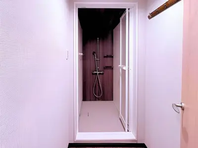 a bathroom with a shower with a mirror at Spacious Family Stay Shinagawa-Kokoro House in Tokyo