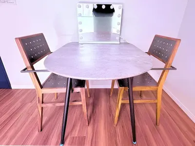 a table with two chairs and a table with a laptop on it at Spacious Family Stay Shinagawa-Kokoro House in Tokyo