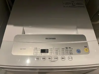 a close up of a kitchen appliance with a cooker at Hatsudai Guest House GRINDEL in Tokyo