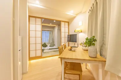 a room with a table and a room with a bedroom at New mansion 5 mins from Yoyogi stations in Tokyo