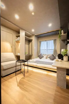 a bedroom with a large bed and a window at New mansion 5 mins from Yoyogi stations in Tokyo