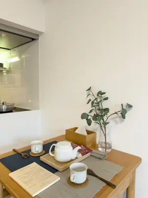 a table with bowls and cups on it in a kitchen at ISSHUKU NOMA\u6c60\u888bII 102 - Quad Room in Tokyo