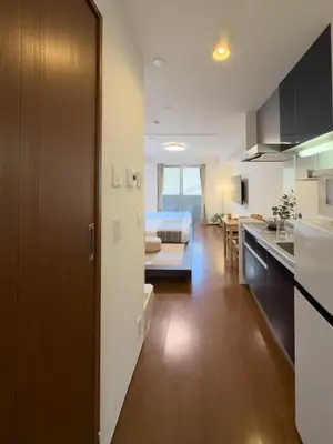a kitchen and living room with a bed in a room at ISSHUKU NOMA\u6c60\u888bII 103 - Quad Room in Tokyo