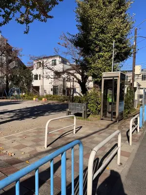 a bus stop on the side of a street at ISSHUKU NOMA\u6c60\u888bII 105 - Quad Room in Tokyo