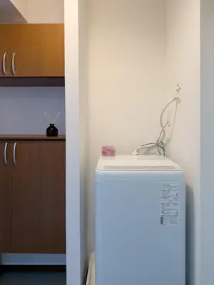 a white refrigerator in a kitchen with a counter at ISSHUKU NOMA\u6c60\u888bII 105 - Quad Room in Tokyo