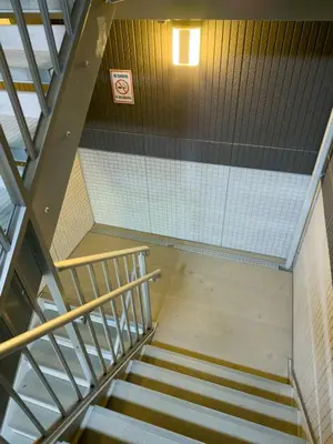 a staircase in a building with a stair case at ISSHUKU NOMA\u6c60\u888bII 301 - Spacious Room for 5 Guests in Tokyo