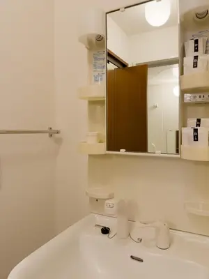 a bathroom with a sink and a mirror at ISSHUKU NOMA\u6c60\u888bII 303 - Quad Room in Tokyo