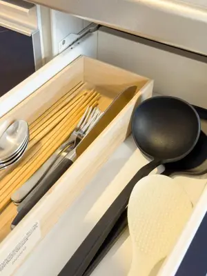 a drawer with a knife and a utensils in it at ISSHUKU NOMA\u6c60\u888bII 303 - Quad Room in Tokyo