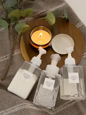 a table with two bottles of soap and a candle at ISSHUKU NOMA\u6c60\u888bII 305 - Quad Room in Tokyo