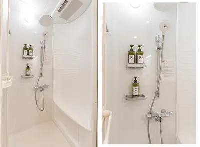 a bathroom with a shower and a walk in shower at 80m to Aoto Station Elevator Access 35 Min Direct to Haneda Airport Direct Train to Narita Airport Easy Access to Ginza Asakusa Disney Skytree Convenience Store and Pharmacy Downstairs in Tokyo