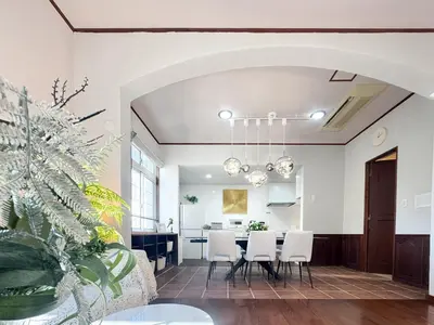 a dining room and living room with a table and chairs at New Open! Shinjuku 5 bedrooms 3 bathrooms Large Villa 2000 sq ft, kids play room, max 16ppl, 4min train to Shinjuku - Magnolia Hotel Shinjuku in Tokyo