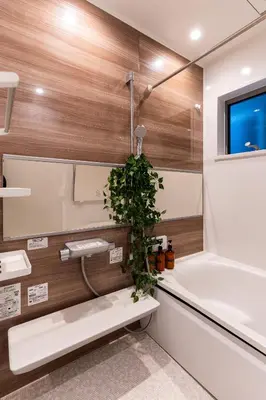 a bathroom with a sink and a tub and a plant at 4LDK Skytree Retreat in Tokyo