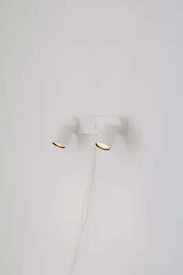 a white wall outlet with a cord plugged into it at 4LDK Skytree Retreat in Tokyo