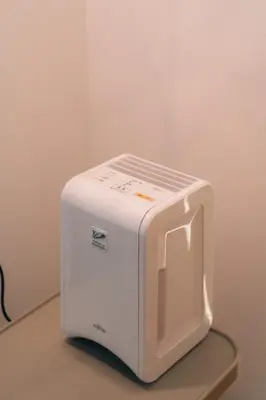 a white toaster sitting on top of a counter at 4LDK Skytree Retreat in Tokyo