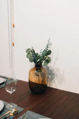 a vase with a plant in it on a table at 4LDK Skytree Retreat in Tokyo