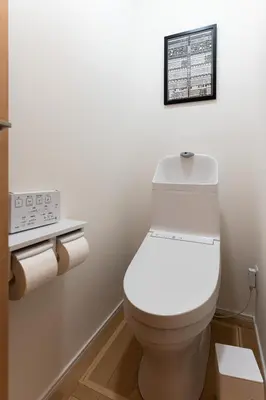 a bathroom with a white toilet and a sign on the wall at 4LDK Skytree Retreat in Tokyo