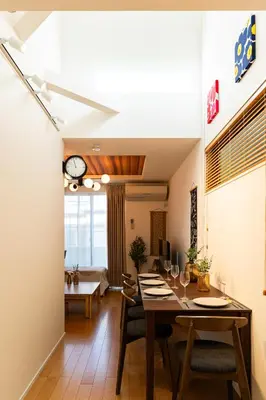 a dining room with a long table and chairs at 4LDK Skytree Retreat in Tokyo
