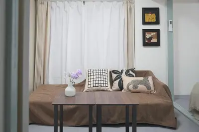 a room with a bed with a table and a window at \u6cca\u5bb6\u6771\u795eHakuya toshin in Wada