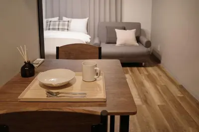 a dining room table with a plate and fork and knife at \u6cca\u5bb6\u6771\u795eHakuya toshin in Wada
