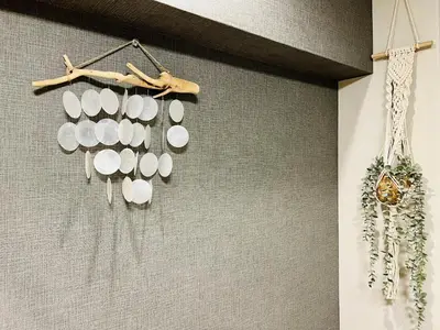 a bunch of white dishes hanging on a wall at TokyoShinjuk Station800meterskabukicho2minutes224 in Tokyo