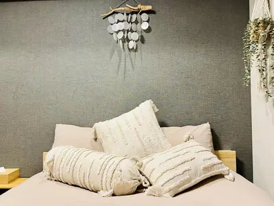 a bed with two pillows on it in a bedroom at TokyoShinjuk Station800meterskabukicho2minutes224 in Tokyo