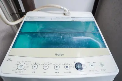 a tablet computer sitting on top of a machine at 102Room,Free Parking Only 1 Stop from Ikebukuro Entire 33m on 1st Floor 2 Bedrooms for up to 6 Guests 3Minute Walk to Don Quijote in Tokyo