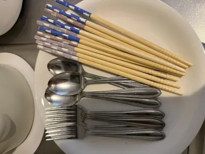 a plate with utensils and forks and spoons at 401Room,7-minute walk from Uguisudani Station located on the 4nd floor of an apartment-style building Twin room No elevator in Tokyo