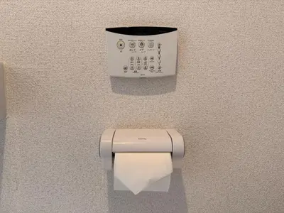 a toilet paper dispenser with a roll of toilet paper at 401Room,7-minute walk from Uguisudani Station located on the 4nd floor of an apartment-style building Twin room No elevator in Tokyo