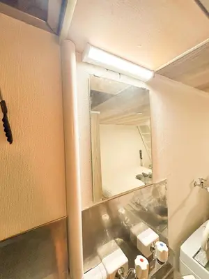 a bathroom with a sink and a mirror at 203 Quiet area walking distance of Shinjuku Shin-Okubo district in Tokyo
