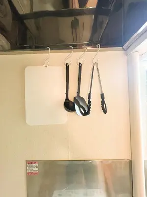 four kitchen utensils are hanging on a wall at 203 Quiet area walking distance of Shinjuku Shin-Okubo district in Tokyo