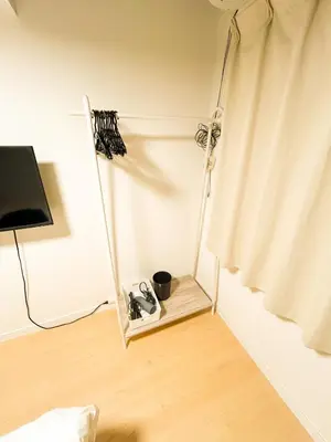a room with a mirror next to a curtain at 203 Quiet area walking distance of Shinjuku Shin-Okubo district in Tokyo
