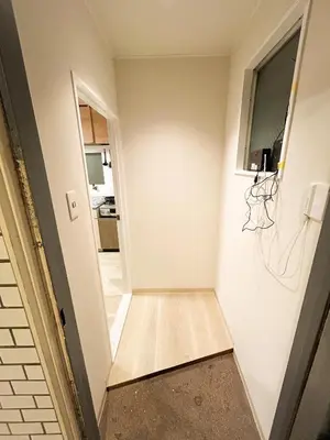 a room with a hallway with white walls and wooden floors at Shinjyuku area walk to Kabuki cho 15 min in Tokyo
