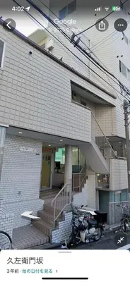 a house with a motorcycle parked in front of it at Shinjyuku area walk to Kabuki cho 15 min in Tokyo