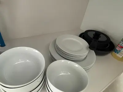 three stacks of plates and bowls on a counter at \u3055\u304f\u3089\u65c5\u9928 \u9ad8\u5186\u5bfa\u5317\u5343\u5229\u4f11 301\u53f7\u5ba4 in Tokyo