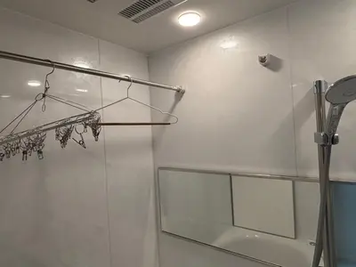 a bathroom with a shower with a glass door at \u3055\u304f\u3089\u65c5\u9928 \u9ad8\u5186\u5bfa\u5317\u5343\u5229\u4f11 301\u53f7\u5ba4 in Tokyo