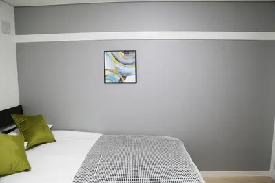 a bedroom with a bed and a picture on the wall at PR203 Winter Tokyo Shinjuku Xmas Lights New Year Shrine in Tokyo
