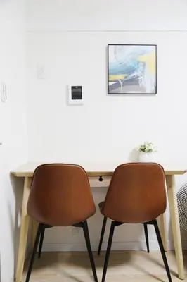 a desk with two chairs and a picture on the wall at PR203 Winter Tokyo Shinjuku Xmas Lights New Year Shrine in Tokyo