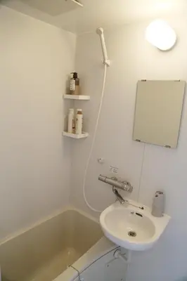 a white bathroom with a sink and a bath tub at PR203 Winter Tokyo Shinjuku Xmas Lights New Year Shrine in Tokyo