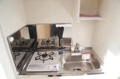 a small kitchen with a stove and a sink at PR203 Winter Tokyo Shinjuku Xmas Lights New Year Shrine in Tokyo