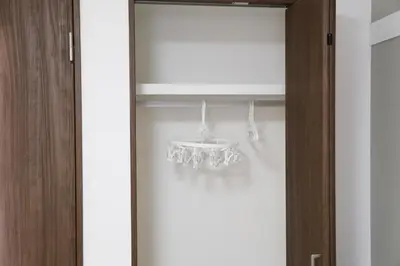 a closet with wine glasses on a shelf at PR204 Shinjuku Perfect location for Kabukichō in Tokyo