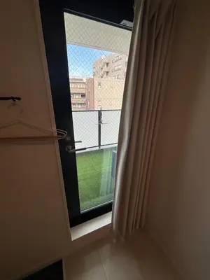 a door with a window with a view of a building at \u3055\u304f\u3089\u65c5\u9928 \u9ad8\u5186\u5bfa\u5317 \u5343\u5229\u4f11401\u53f7\u5ba4 in Tokyo