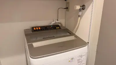 a machine sitting on top of a refrigerator at YIYou Japan\u79cb\u8449\u539f401 in Tokyo