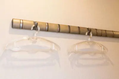 a pair of glasses hanging on a curtain at AMBLE Asakusa in Tokyo