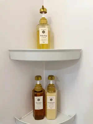 three bottles of essential oils on a shelf at The Travelers Court Bunkyo III in Tokyo