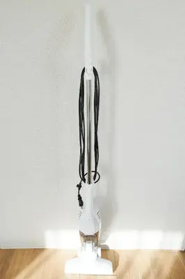 a white vase with black wires in a room at Unite Stay Urayasu201 Close to Disneyland, 15 minutes by bus, 8 minutes by car, and good access from the nearest station to Tokyo Station, Ginza, and Asakusa in Tokyo
