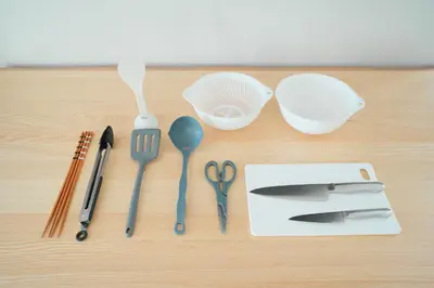 a table with utensils on a wooden table at Unite Stay Urayasu201 Close to Disneyland, 15 minutes by bus, 8 minutes by car, and good access from the nearest station to Tokyo Station, Ginza, and Asakusa in Tokyo