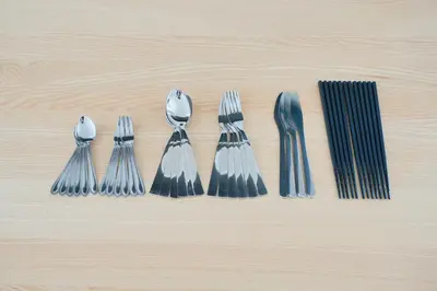 a group of forks and spoons on a wooden table at Unite Stay Urayasu201 Close to Disneyland, 15 minutes by bus, 8 minutes by car, and good access from the nearest station to Tokyo Station, Ginza, and Asakusa in Tokyo