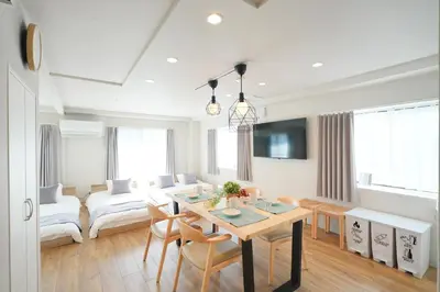 a living room with a table and a couch at Unite Stay Urayasu201 Close to Disneyland, 15 minutes by bus, 8 minutes by car, and good access from the nearest station to Tokyo Station, Ginza, and Asakusa in Tokyo
