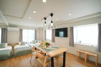a living room with a table and a couch at Unite Stay Urayasu201 Close to Disneyland, 15 minutes by bus, 8 minutes by car, and good access from the nearest station to Tokyo Station, Ginza, and Asakusa in Tokyo