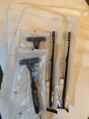 a pair of scissors in plastic bags on a table at Wood River House \u9580\u524d\u4ef2\u753a\u99c5 \u6728\u5834\u99c5 in Tokyo